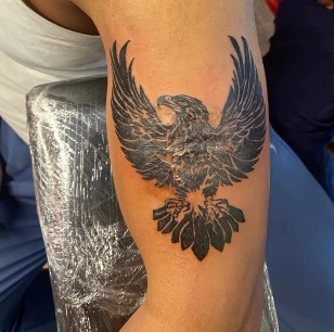 Eagle arm tattoo by PRANA Tattoo and Piercing Studio in Vellore