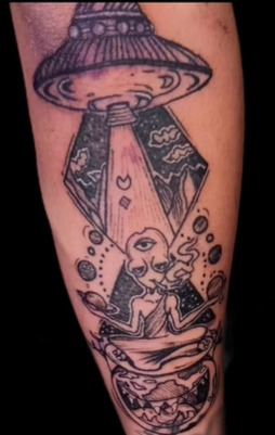 Illustrative UFO tattoo by PRANA Tattoo and Piercing Studio in Vellore