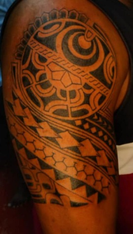 Bold tribal shoulder tattoo by PRANA Tattoo and Piercing Studio in Vellore